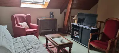 Coin salon dans l'établissement Location chambre dans villa