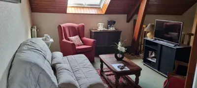Coin salon dans l'établissement Location chambre dans villa