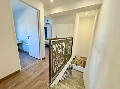 Un ou plusieurs lits dans un hébergement de l'établissement Grange rénovée en duplex idéalement située