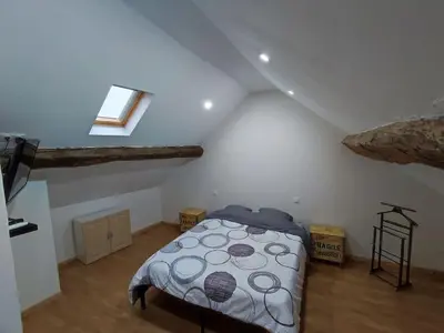 Un ou plusieurs lits dans un hébergement de l'établissement Agréable maison 8 personnes WIFI et clim