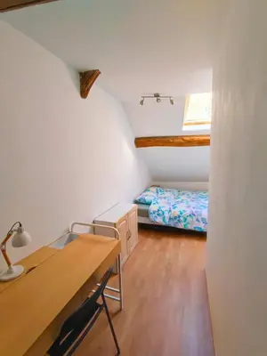 Un ou plusieurs lits dans un hébergement de l'établissement Agréable maison 8 personnes WIFI et clim
