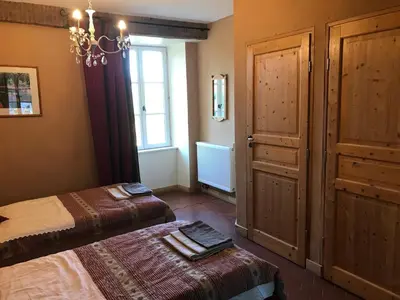 Un ou plusieurs lits dans un hébergement de l'établissement GITE LES PETITS GALETS Bourgogne du Sud