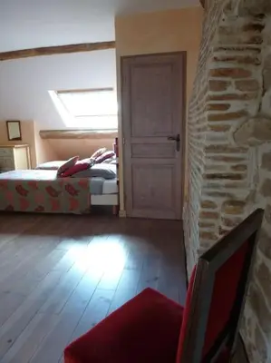 Un ou plusieurs lits dans un hébergement de l'établissement GITE LES PETITS GALETS Bourgogne du Sud