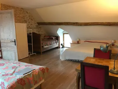 Un ou plusieurs lits dans un hébergement de l'établissement GITE LES PETITS GALETS Bourgogne du Sud