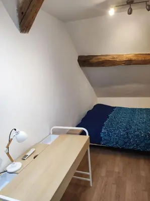 Un ou plusieurs lits dans un hébergement de l'établissement La maison de vos vacances