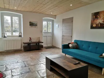 Coin salon dans l'établissement L'Alcôve des Ondines