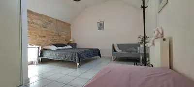 Un ou plusieurs lits dans un hébergement de l'établissement Escape4Dijon