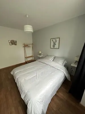 Un ou plusieurs lits dans un hébergement de l'établissement Gîte 10 personnes avec spa privatif