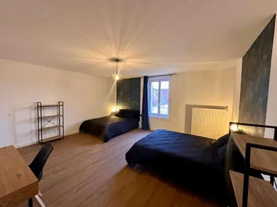 Un ou plusieurs lits dans un hébergement de l'établissement L'Atelier loft