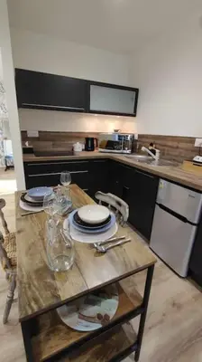 Cuisine ou kitchenette dans l'établissement Tout confort. Appartement 2 pers. centre-ville