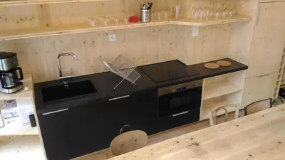 Cuisine ou kitchenette dans l'établissement Lons appartement T1 centre ville
