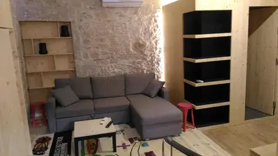 Coin salon dans l'établissement Lons appartement T1 centre ville