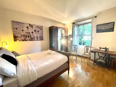Un ou plusieurs lits dans un hébergement de l'établissement La Casa Del Papa - Maison spacieuse avec jardin