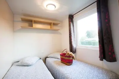 Un ou plusieurs lits dans un hébergement de l'établissement CAMPING LA CLE DE SAONE