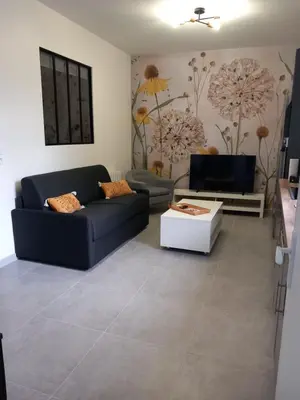Coin salon dans l'établissement La cour fleurie, tout confort