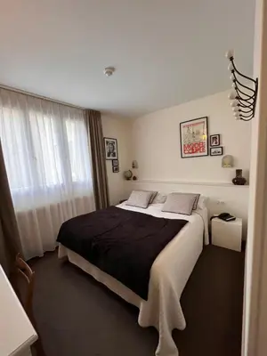 Un ou plusieurs lits dans un hébergement de l'établissement Le Téméraire Hôtel