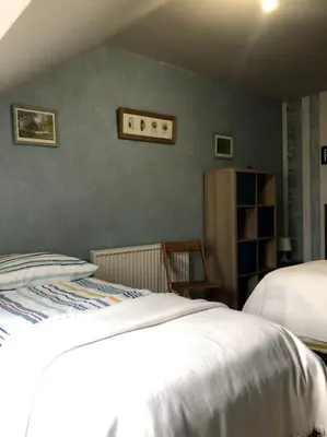 Un ou plusieurs lits dans un hébergement de l'établissement La maison de Jeanne