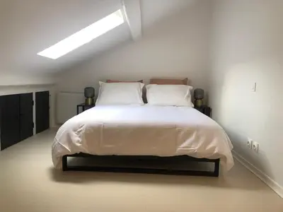 Un ou plusieurs lits dans un hébergement de l'établissement Joli duplex