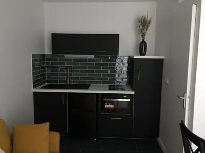 Cuisine ou kitchenette dans l'établissement Joli duplex
