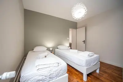 Un ou plusieurs lits dans un hébergement de l'établissement Appartement centre-ville 6 personnes