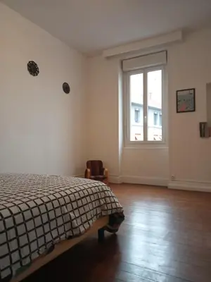 Un ou plusieurs lits dans un hébergement de l'établissement Logement spacieux et lumineux