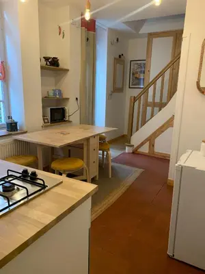 Cuisine ou kitchenette dans l'établissement L'ARCADE