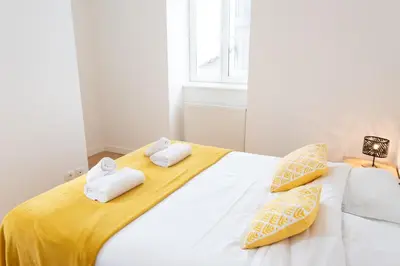 Un ou plusieurs lits dans un hébergement de l'établissement La Pause Péronnaise - Maison de ville en coeur de village