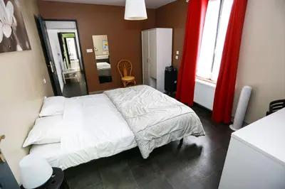 Un ou plusieurs lits dans un hébergement de l'établissement F3 80 m2 Longére plain pied au centre auxonne.