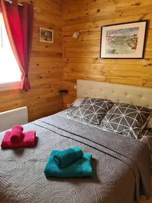 Un ou plusieurs lits dans un hébergement de l'établissement Chalet au coeur du parc du Morvan - Moux-en-Morvan