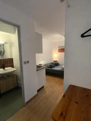 Un ou plusieurs lits dans un hébergement de l'établissement Studio Paisible Cœur de Paray-Le-Monial app 303