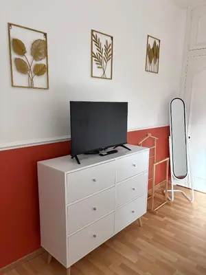 Télévision ou salle de divertissement dans l'établissement Maison au pied des Vignes