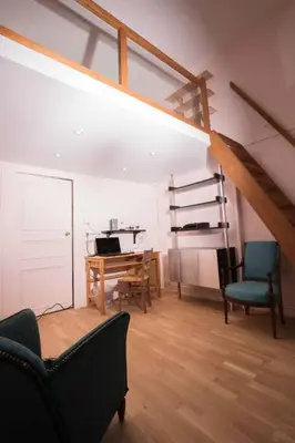 Coin salon dans l'établissement Grand Appartement a Maison sculptée