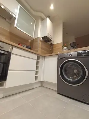 Cuisine ou kitchenette dans l'établissement Le Blue IVY Hyper centre 2 chambres Tout équipe