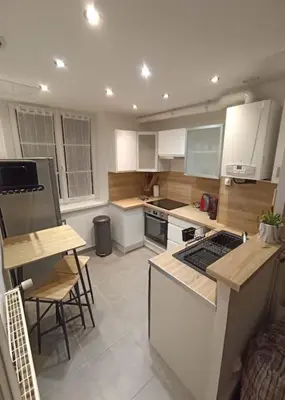 Cuisine ou kitchenette dans l'établissement Le Blue IVY Hyper centre 2 chambres Tout équipe