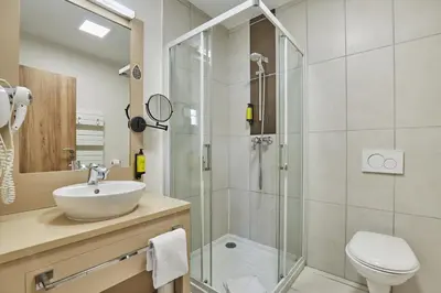 Salle de bains dans l'établissement Appart'hôtel Odalys City - Dijon Centre Les Cordeliers