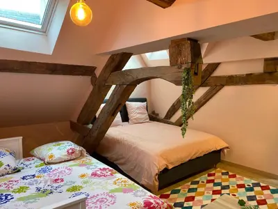 Un ou plusieurs lits dans un hébergement de l'établissement Maison Authentique « Bleue Nuits »