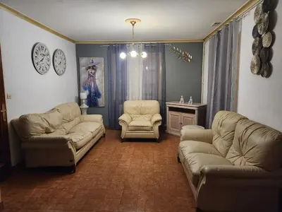 Coin salon dans l'établissement Maison de vacances