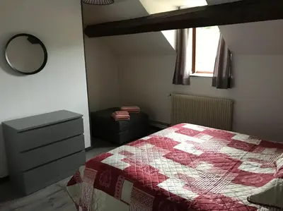 Un ou plusieurs lits dans un hébergement de l'établissement La Bétamotte: Maison entière avec piscine dans le parc du Morvan