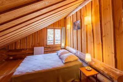 Un ou plusieurs lits dans un hébergement de l'établissement Chalet l'Epicurien - Au calme avec grand jardin