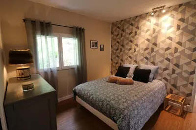 Un ou plusieurs lits dans un hébergement de l'établissement Chalet au bord de l eau