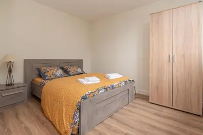Un ou plusieurs lits dans un hébergement de l'établissement Le Pied à Terre de Montcenis - Appt avec parking privé