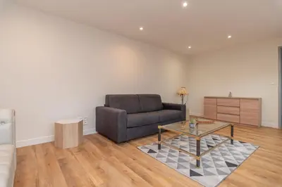 Coin salon dans l'établissement Le Pied à Terre de Montcenis - Appt avec parking privé