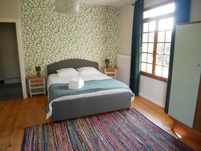 Un ou plusieurs lits dans un hébergement de l'établissement Maison au calme avec jardin à 5 min de Tournus