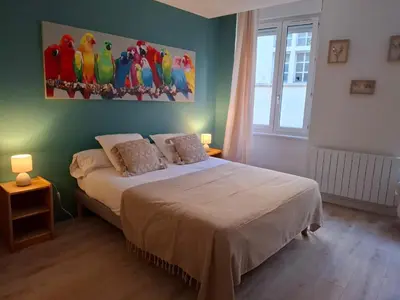 Un ou plusieurs lits dans un hébergement de l'établissement Studio centre Macon place aux herbes