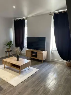 Télévision ou salle de divertissement dans l'établissement L'appart Saint-Laurent