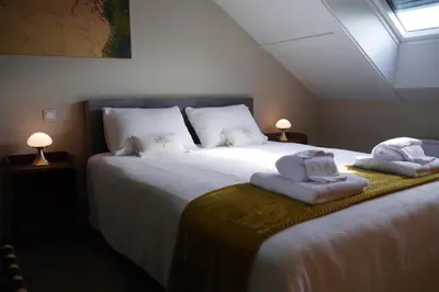 Un ou plusieurs lits dans un hébergement de l'établissement Chambres d'Hôtes La mésange à tête Bleue