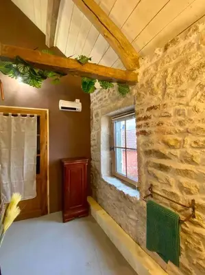 Un ou plusieurs lits dans un hébergement de l'établissement Le nid du coq d'or location appartement