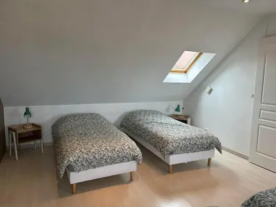 Un ou plusieurs lits dans un hébergement de l'établissement La maison du chêne