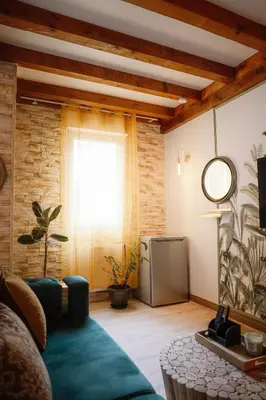 Coin salon dans l'établissement Appart hôtel le 8 La Suite & Spa - parking gratuit -