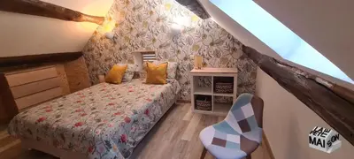 Un ou plusieurs lits dans un hébergement de l'établissement La Petite Maison de l'Oze